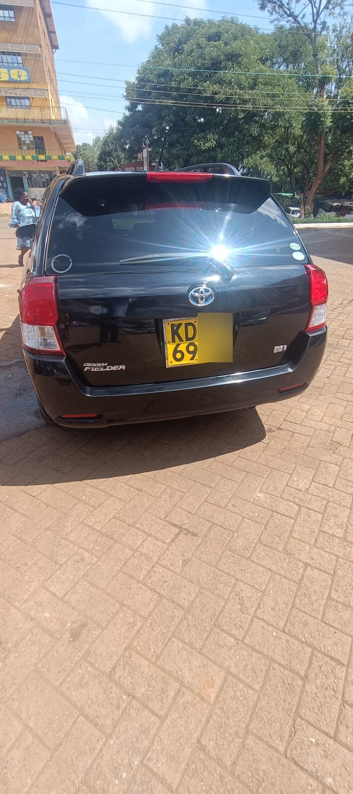 Black Toyota Corolla Fielder rear view