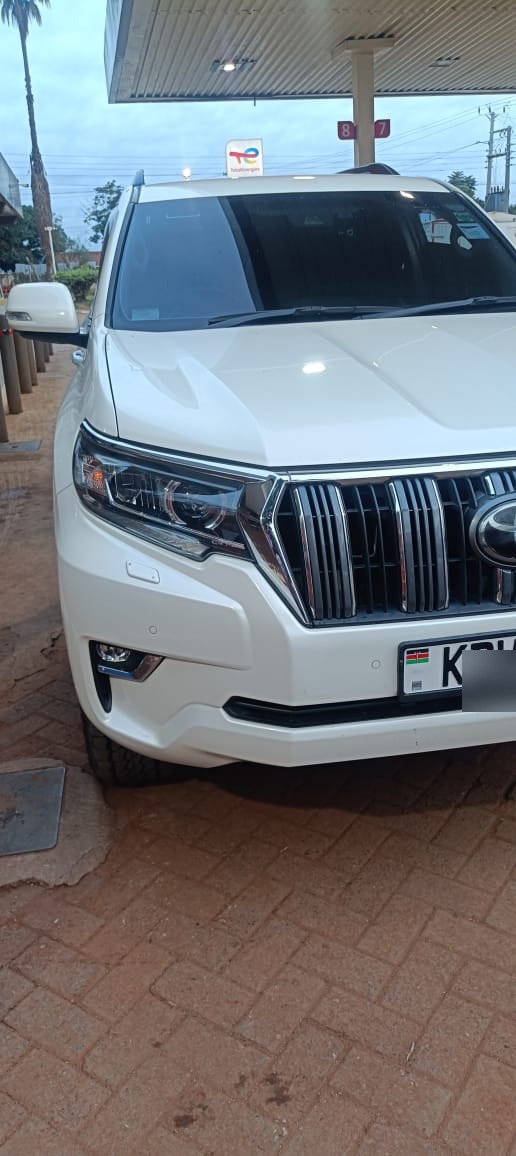White Toyota Land Cruiser Prado close-up front view